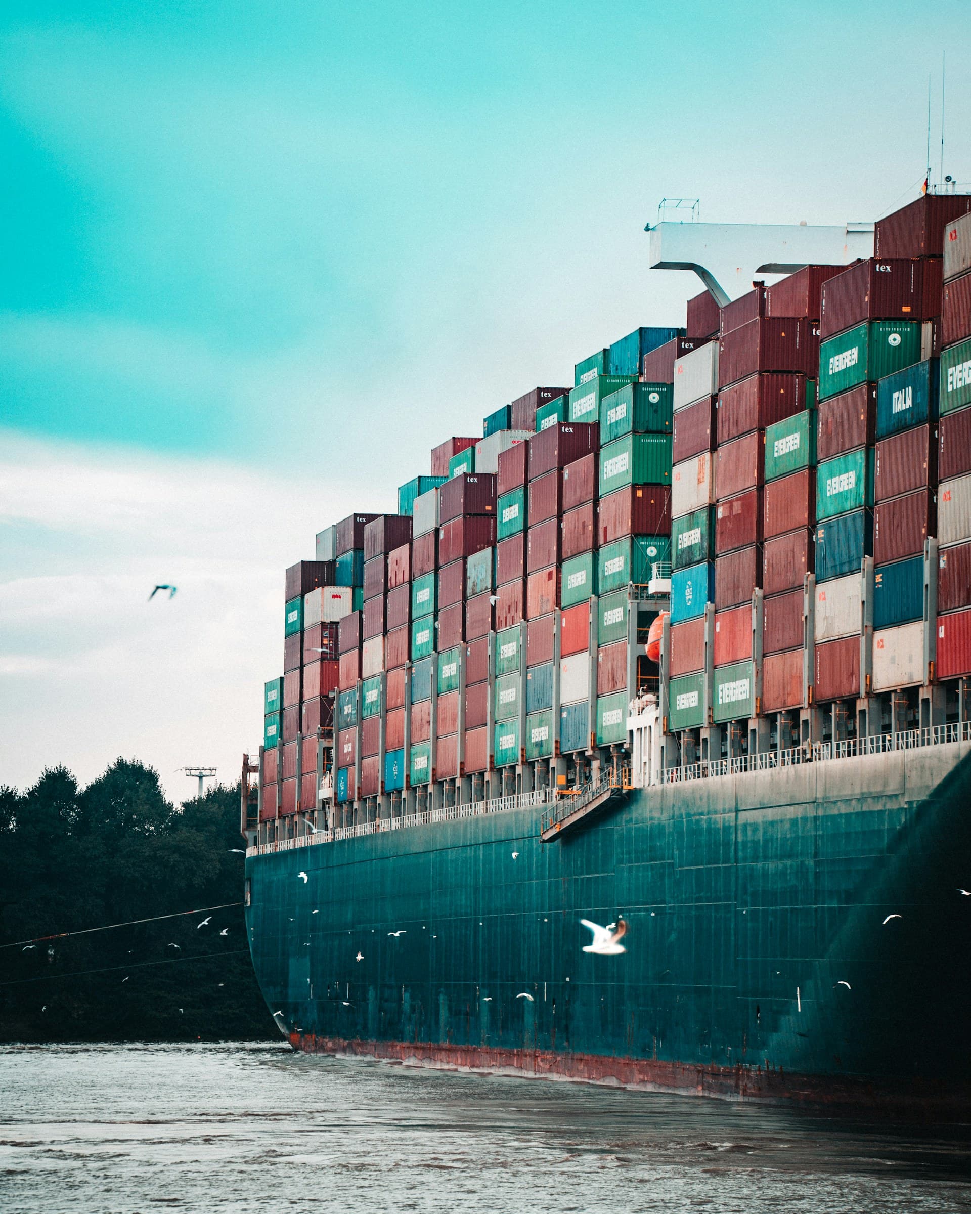 Container ship loaded with stacked shipping containers
